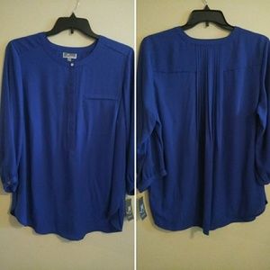 Brand new blue blouse with tag. Will negotiate.